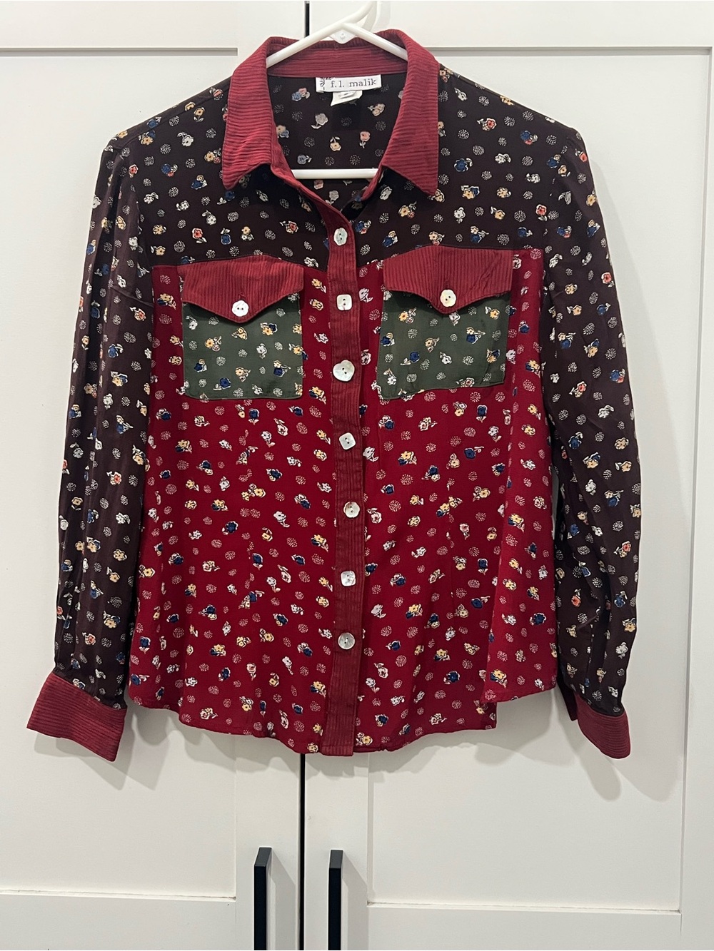 F.L. Malik women’s small branded patchwork floral blouse